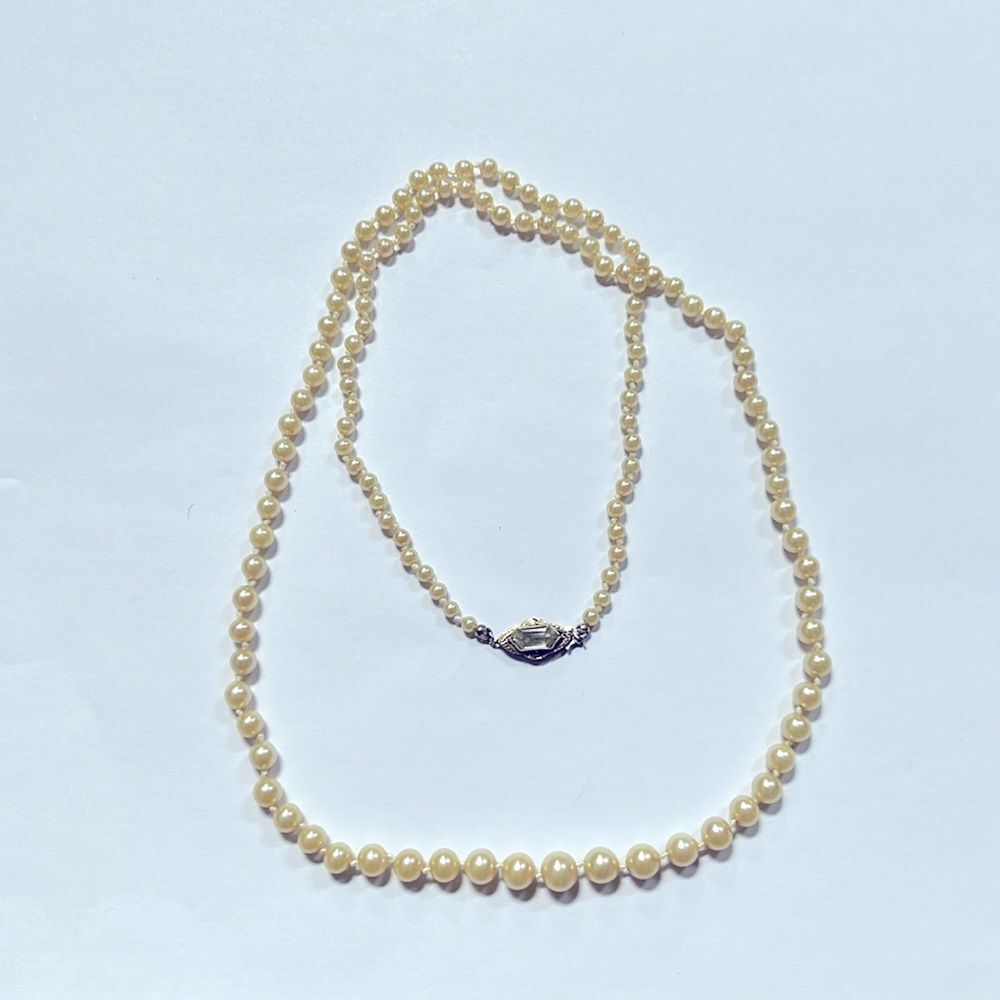 Ivory hand knotted, single strand faux pearls, Deltah signed, vintage